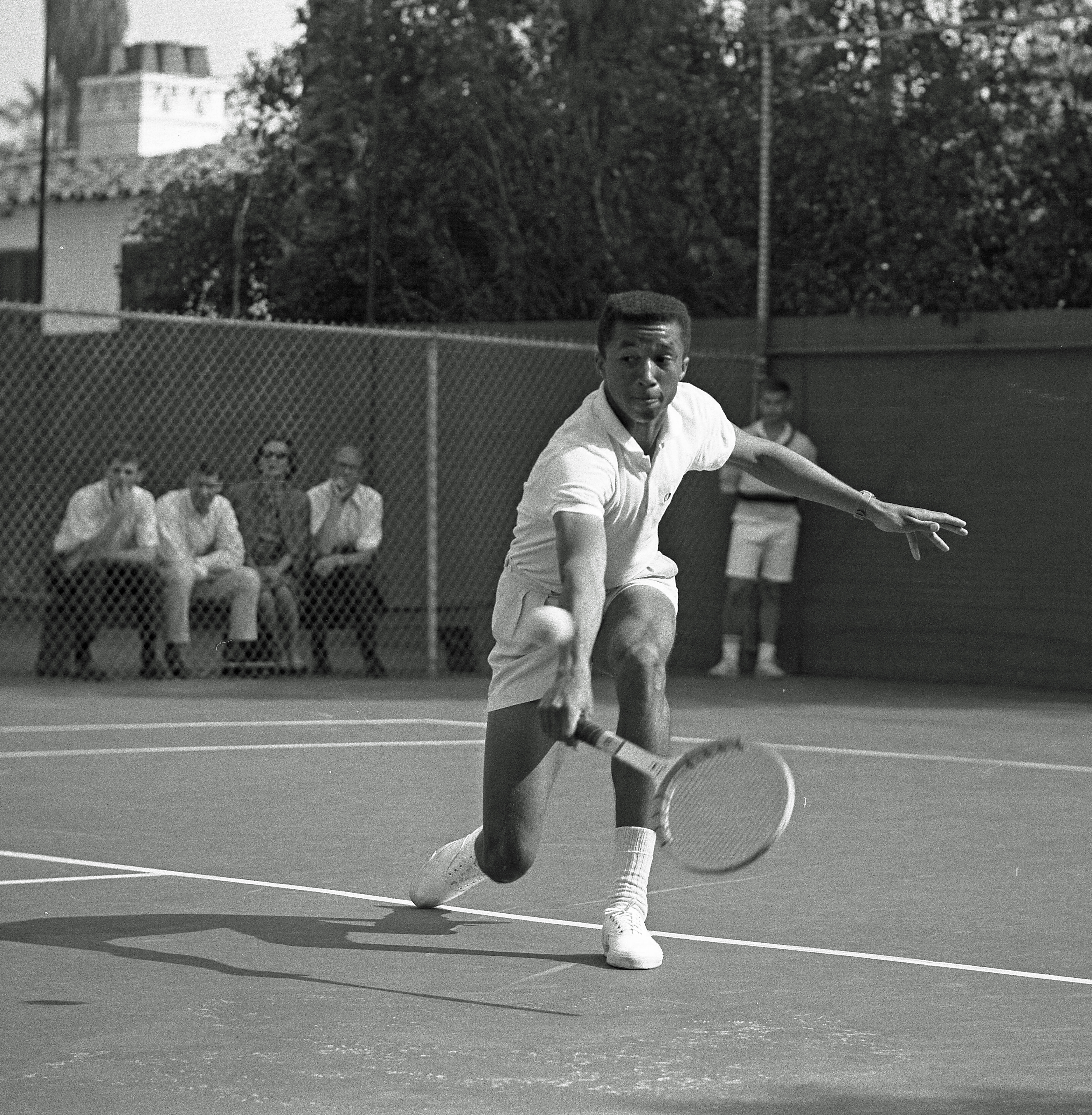 Arthur Ashe playing a backhand volley, UCLA, 1964