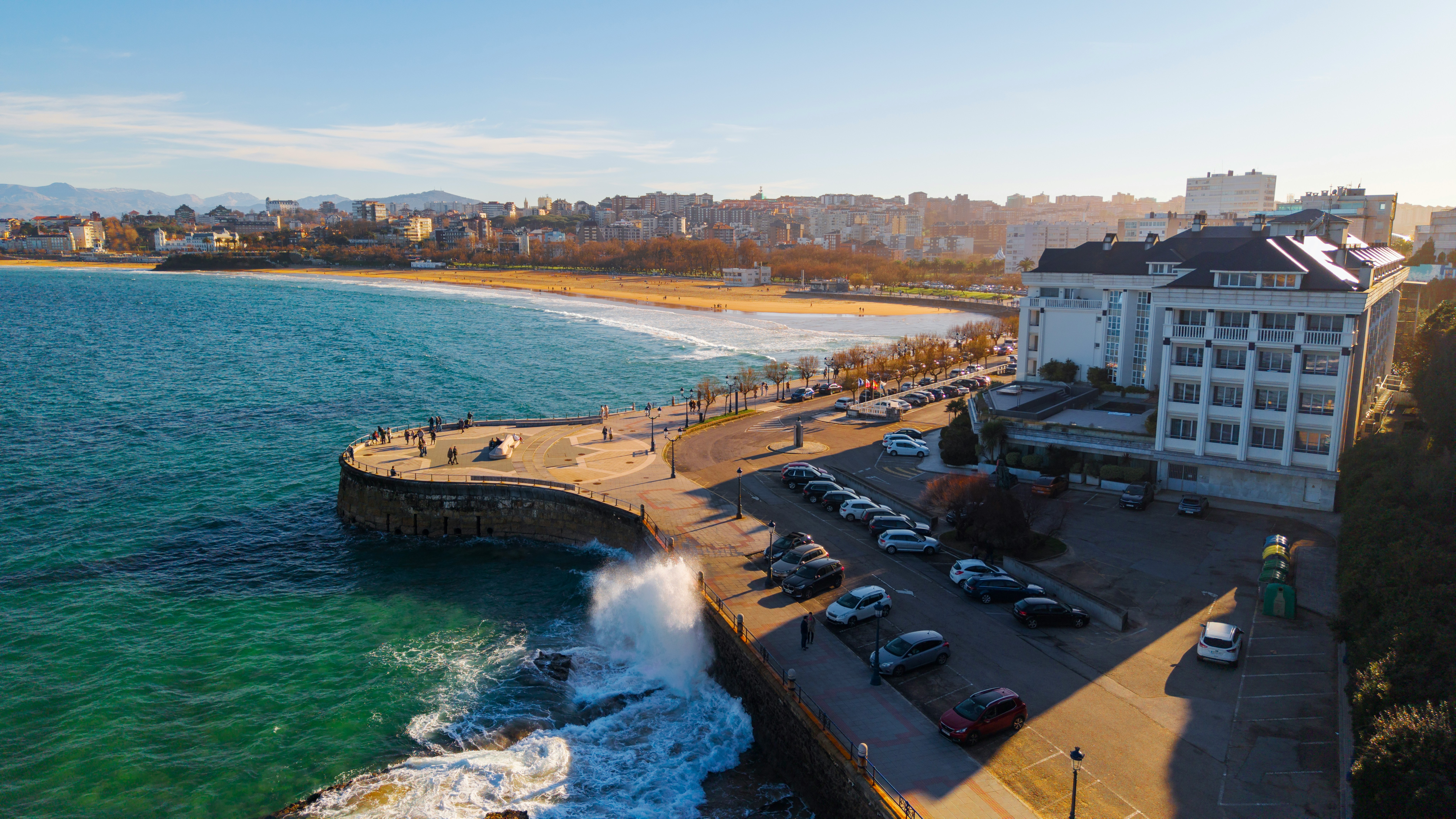Coastal city promenade with ocean waves, representing the Golden Mile walking route to Kingsmead